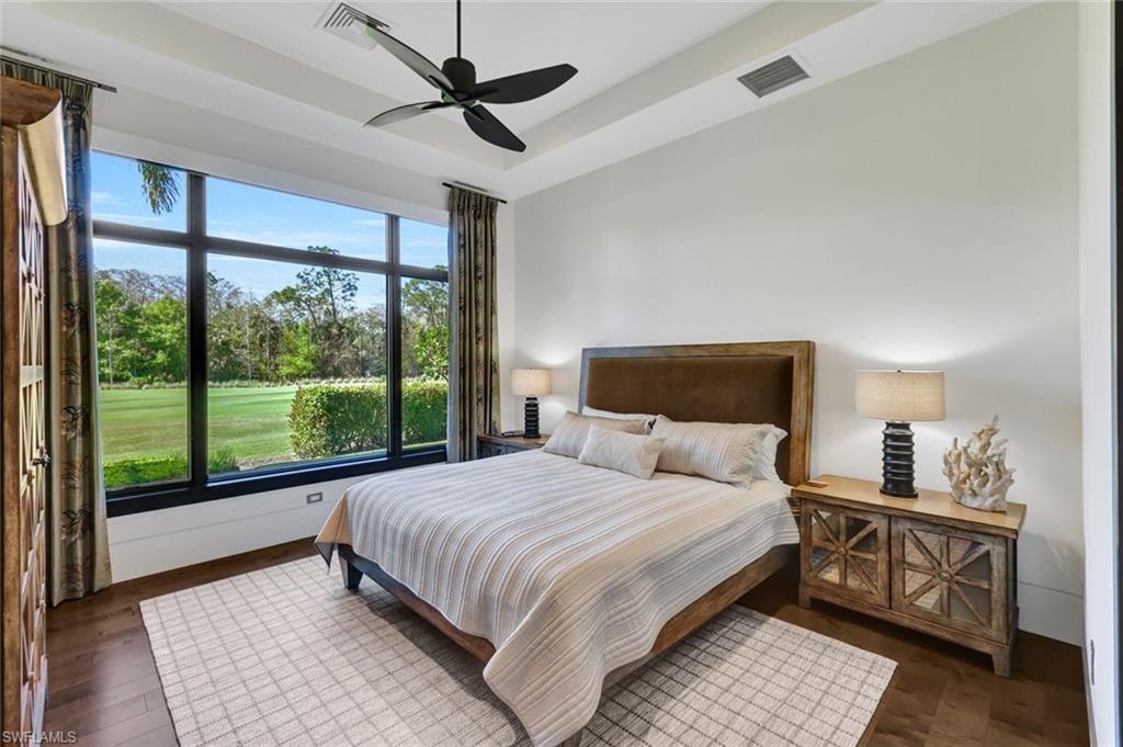 4431 Wayside Drive Naples, FL 34119 - Photo 41 of 49 a bedroom with a large bed and a window