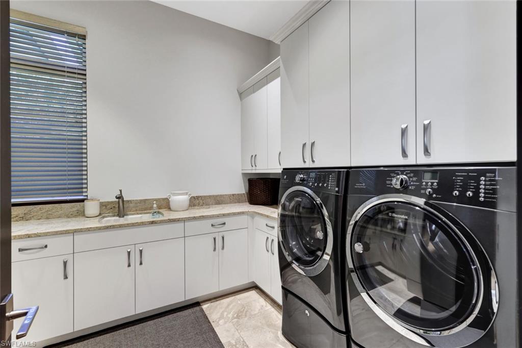4431 Wayside Drive Naples, FL 34119 - Photo 43 of 49 a utility room with a sink dryer and washer
