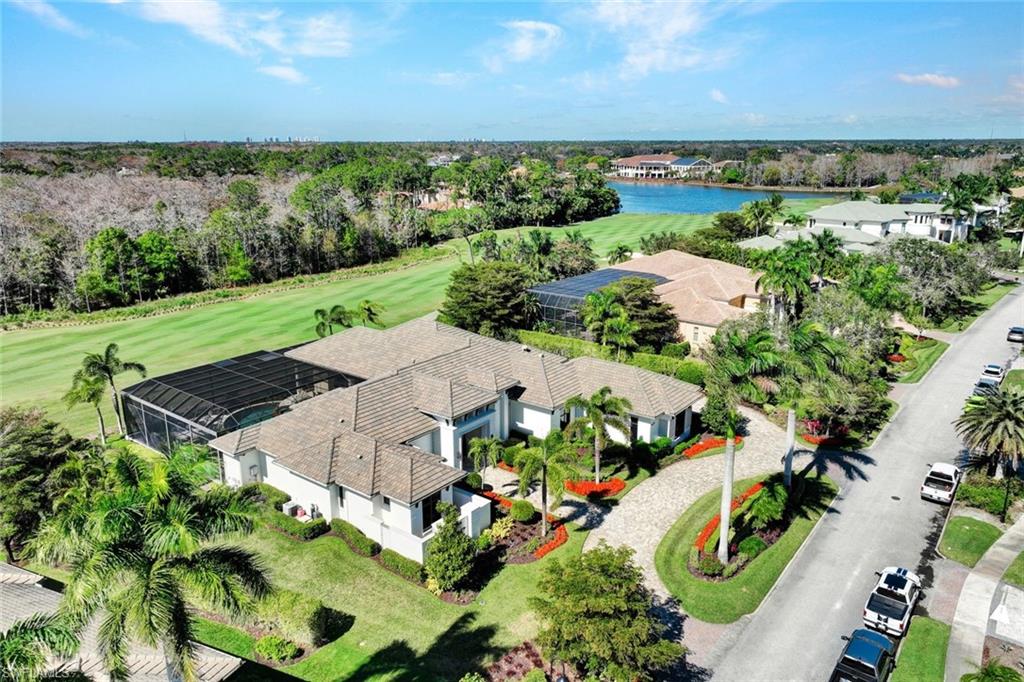 4431 Wayside Drive Naples, FL 34119 - Photo 44 of 49 an aerial view of a house with a garden