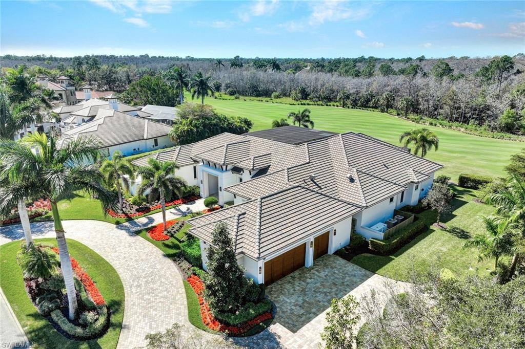 4431 Wayside Drive Naples, FL 34119 - Photo 45 of 49 an aerial view of a house with a garden
