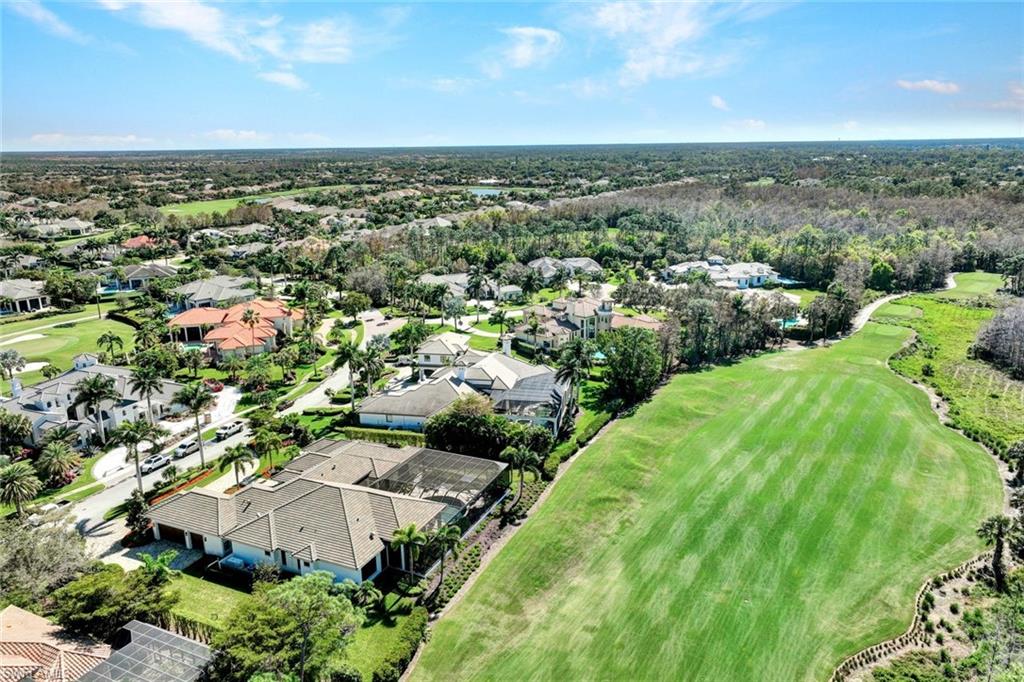 4431 Wayside Drive Naples, FL 34119 - Photo 48 of 49 an aerial view of residential houses with outdoor space and trees