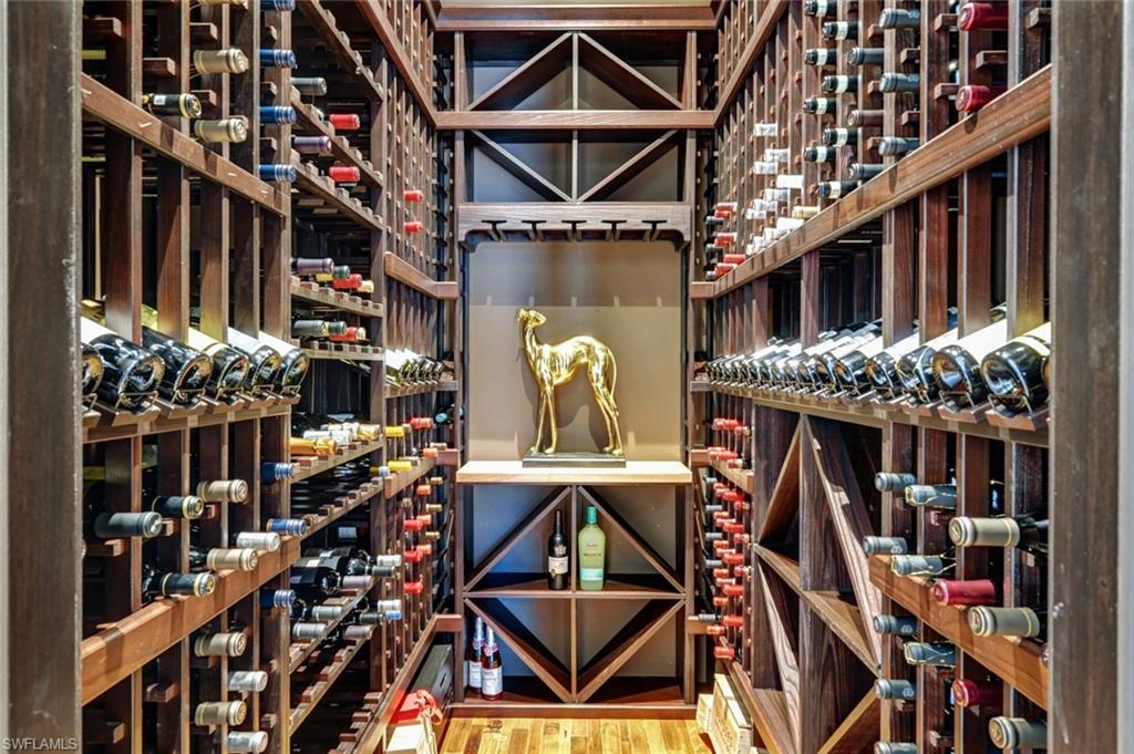 4431 Wayside Drive Naples, FL 34119 - Photo 7 of 49 a roof deck with table and chairs