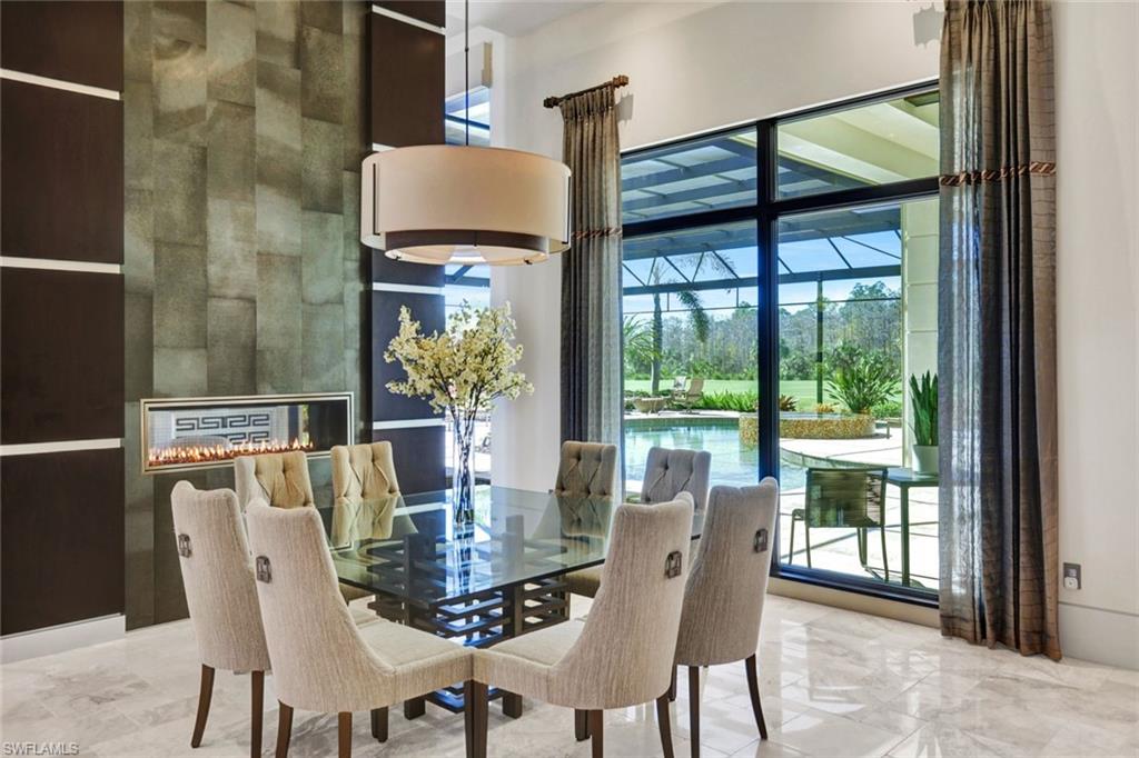 4431 Wayside Drive Naples, FL 34119 - Photo 8 of 49 a dining room with furniture and large windows