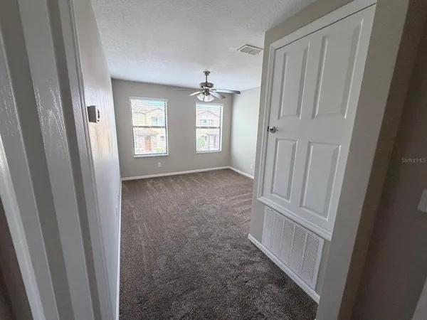 a view of an empty room with a window