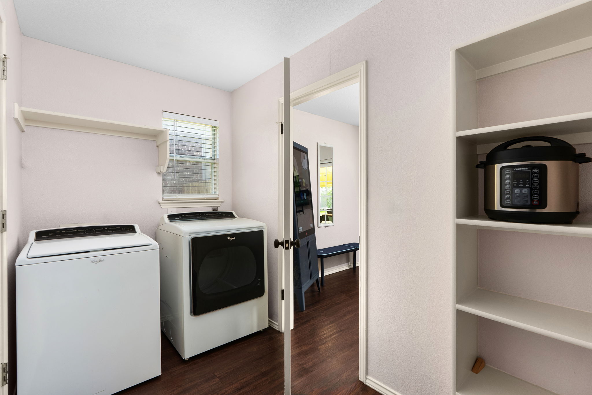 7906 Briarton Drive Austin, TX 78747 - Photo 18 of 38 a kitchen with a stove and a microwave