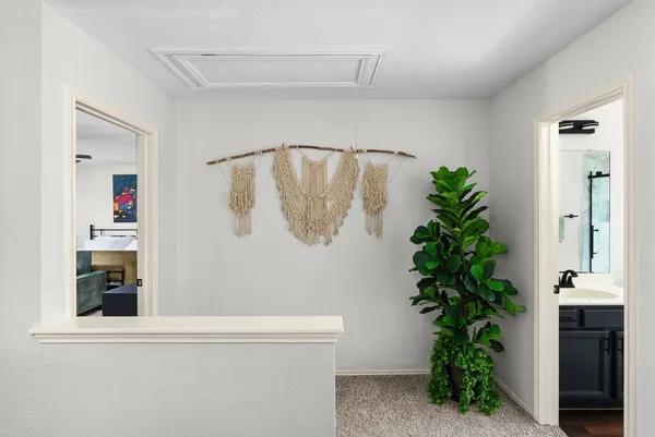 a bedroom with a bed and a flat screen television