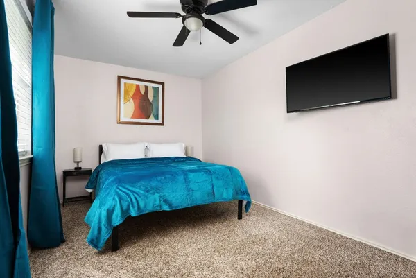 a view of a room with a bed