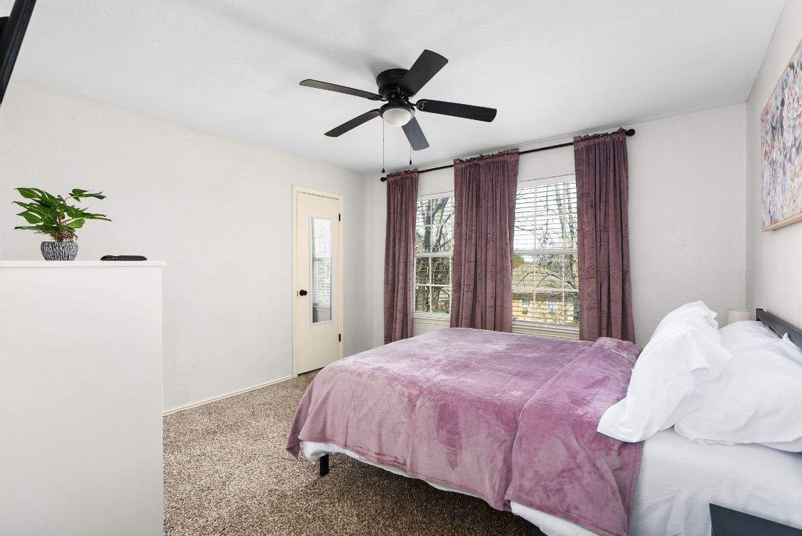 7906 Briarton Drive Austin, TX 78747 - Photo 30 of 38 a bedroom with a bed and a window