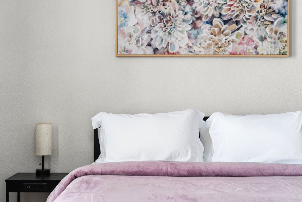 7906 Briarton Drive Austin, TX 78747 - Photo 31 of 38 a bedroom with a bed and wall painting on the wall