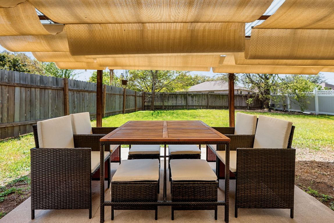 7906 Briarton Drive Austin, TX 78747 - Photo 35 of 38 a view of a patio with table and chairs