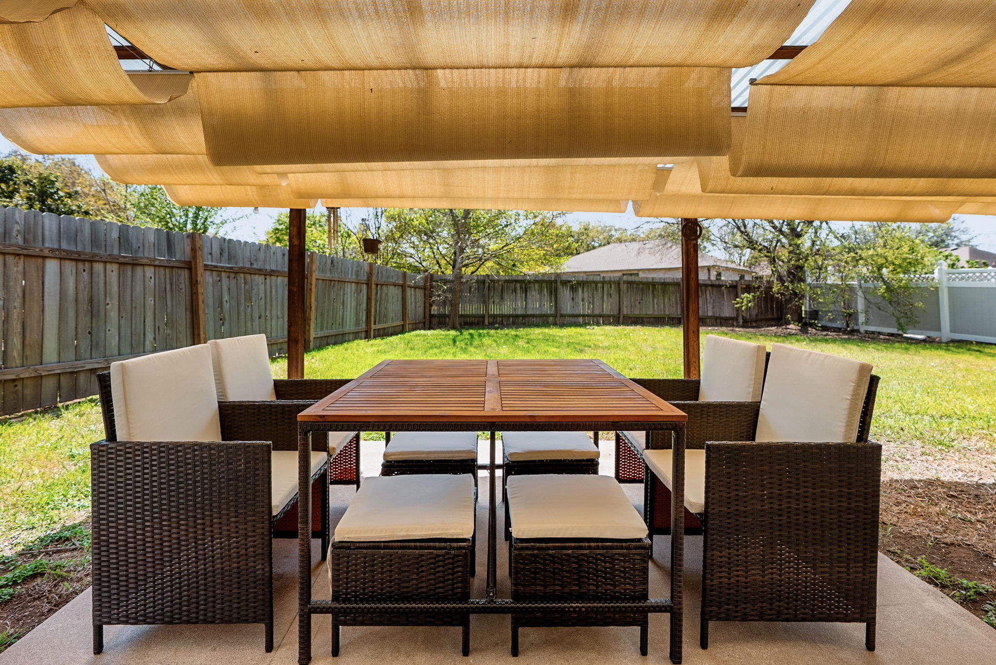 7906 Briarton Drive Austin, TX 78747 - Photo 35 of 38 a view of a patio with a table chairs and a table
