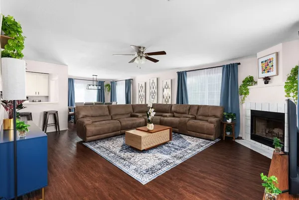 a living room with furniture and a fireplace