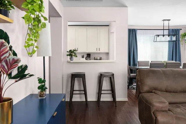 a view of a dining room with furniture window and wooden floor