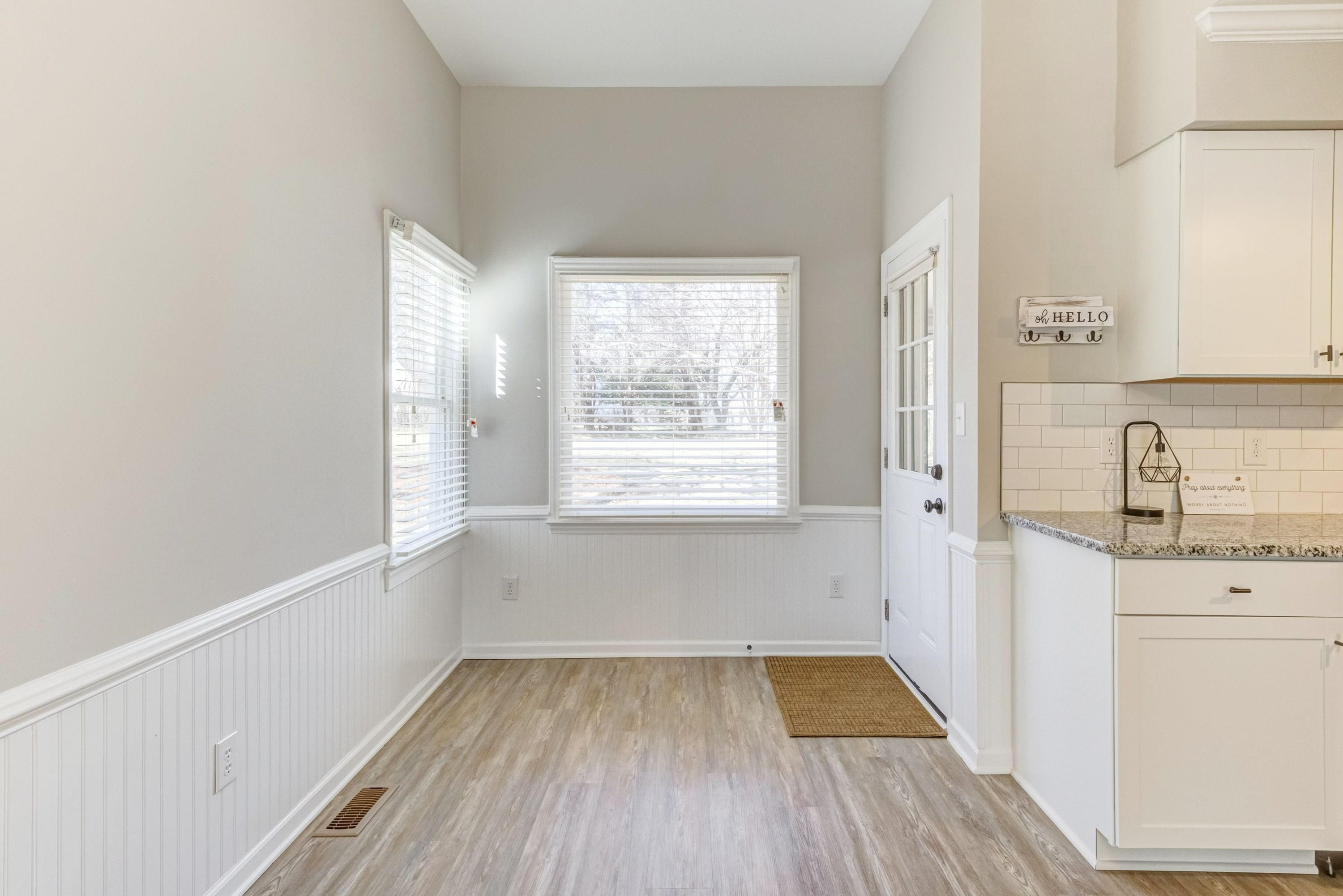 9305 Tallgrass Road Raleigh, NC 27603 - Photo 14 of 49 Note the wainscoating and chairrail molding plus new lighting and new flooring! Dining Area