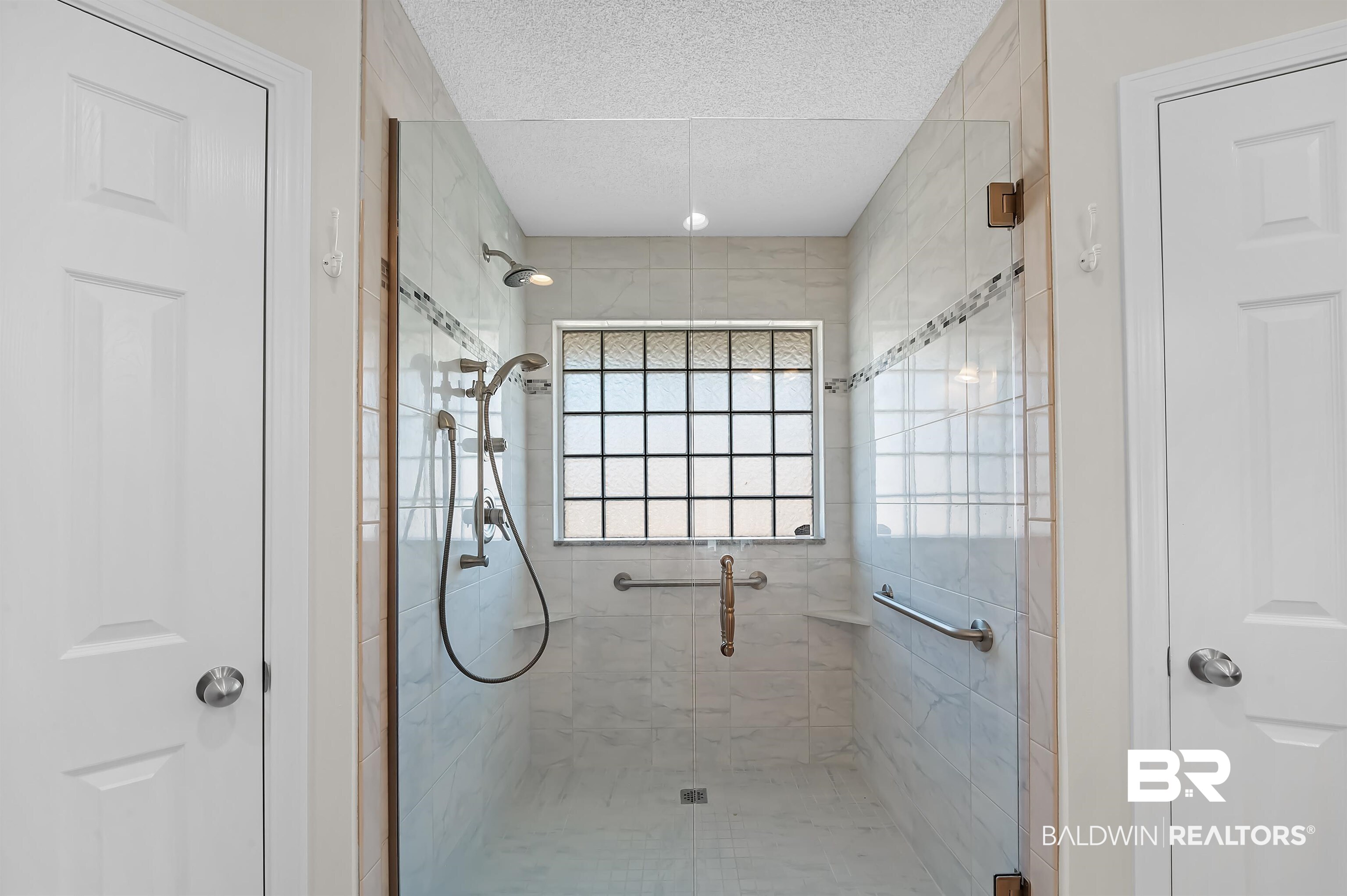 421 Collinwood Loop Foley, AL 36535 - Photo 40 of 62 Bathroom with a textured ceiling and walk in shower