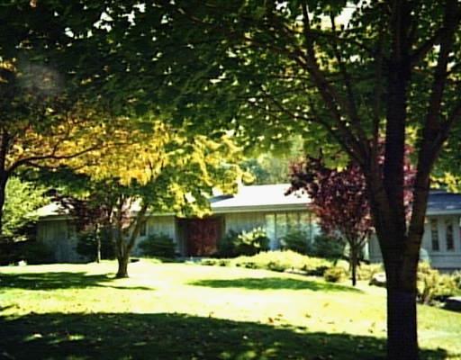 a view of swimming pool with a yard