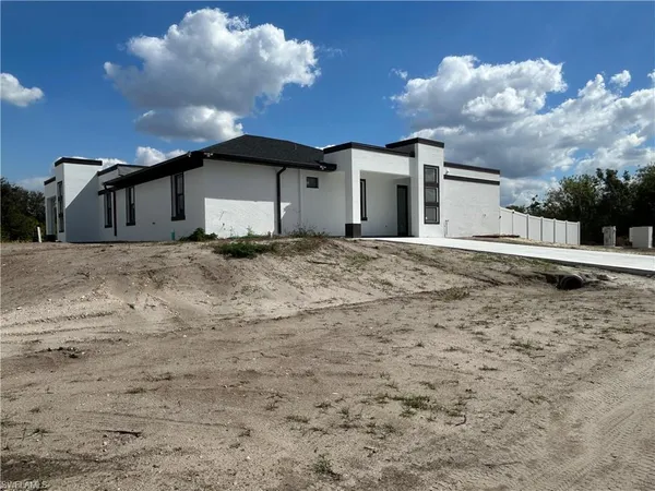 a house with yard in front of it