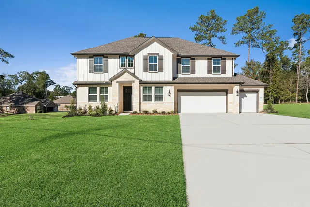 a front view of a house with a garden and porch