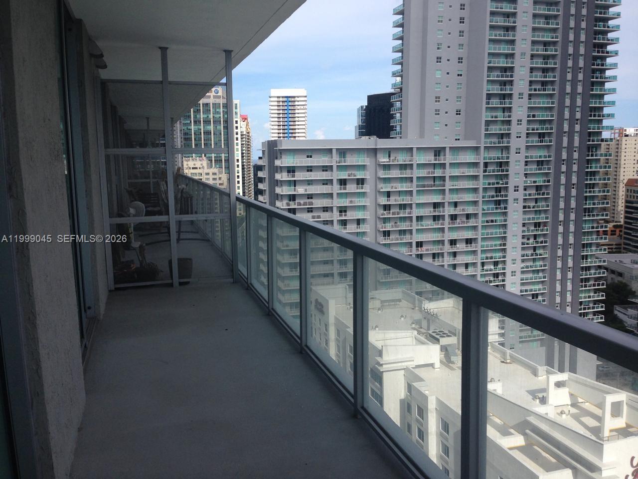 79 Southwest 12th Street, Unit 2702S Miami, FL 33130 - Photo 2 of 9 a view of balcony with furniture