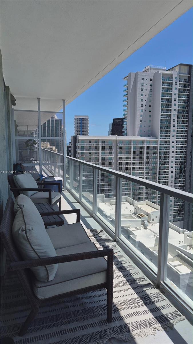 79 Southwest 12th Street, Unit 2702S Miami, FL 33130 - Photo 7 of 9 a living room with furniture
