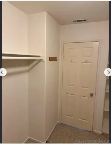 a view of a kitchen from the hallway