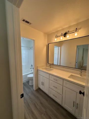 a view of a porch with wooden floor