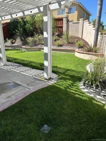 a view of a porch and garden