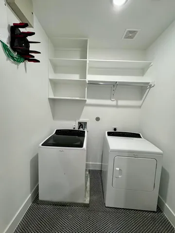 a utility room with dryer and washer