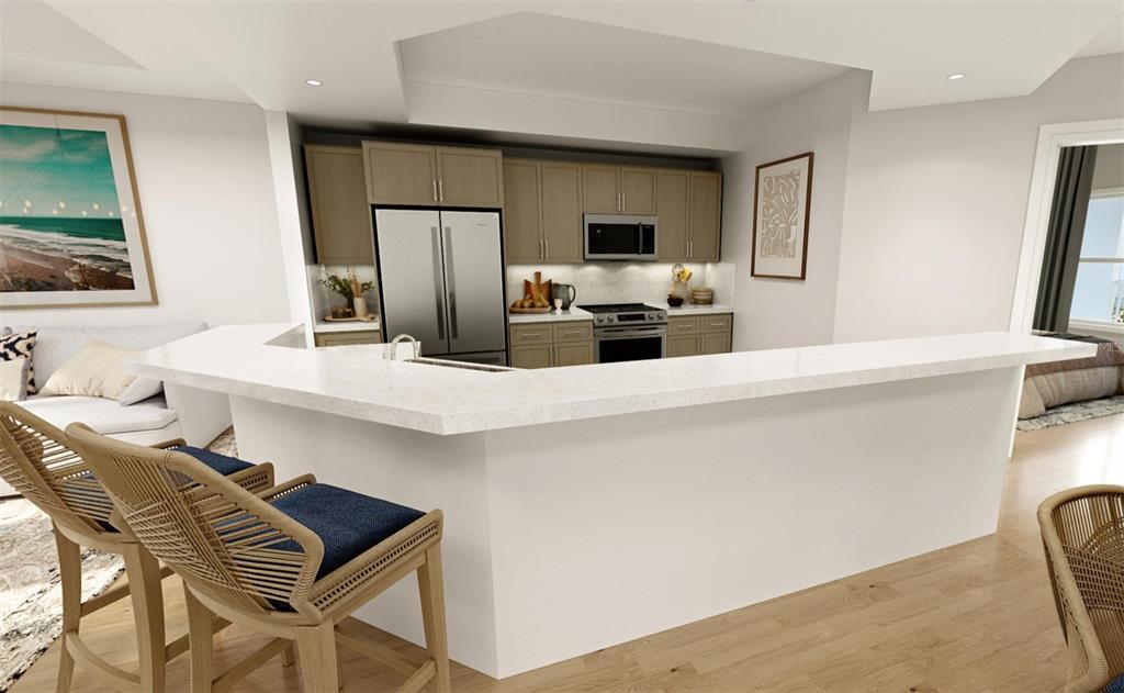 5015 Highway 19, Unit 501 New Port Richey, FL 34652 - Photo 5 of 24 a kitchen with stainless steel appliances a sink a stove a microwave a counter top space and cabinets