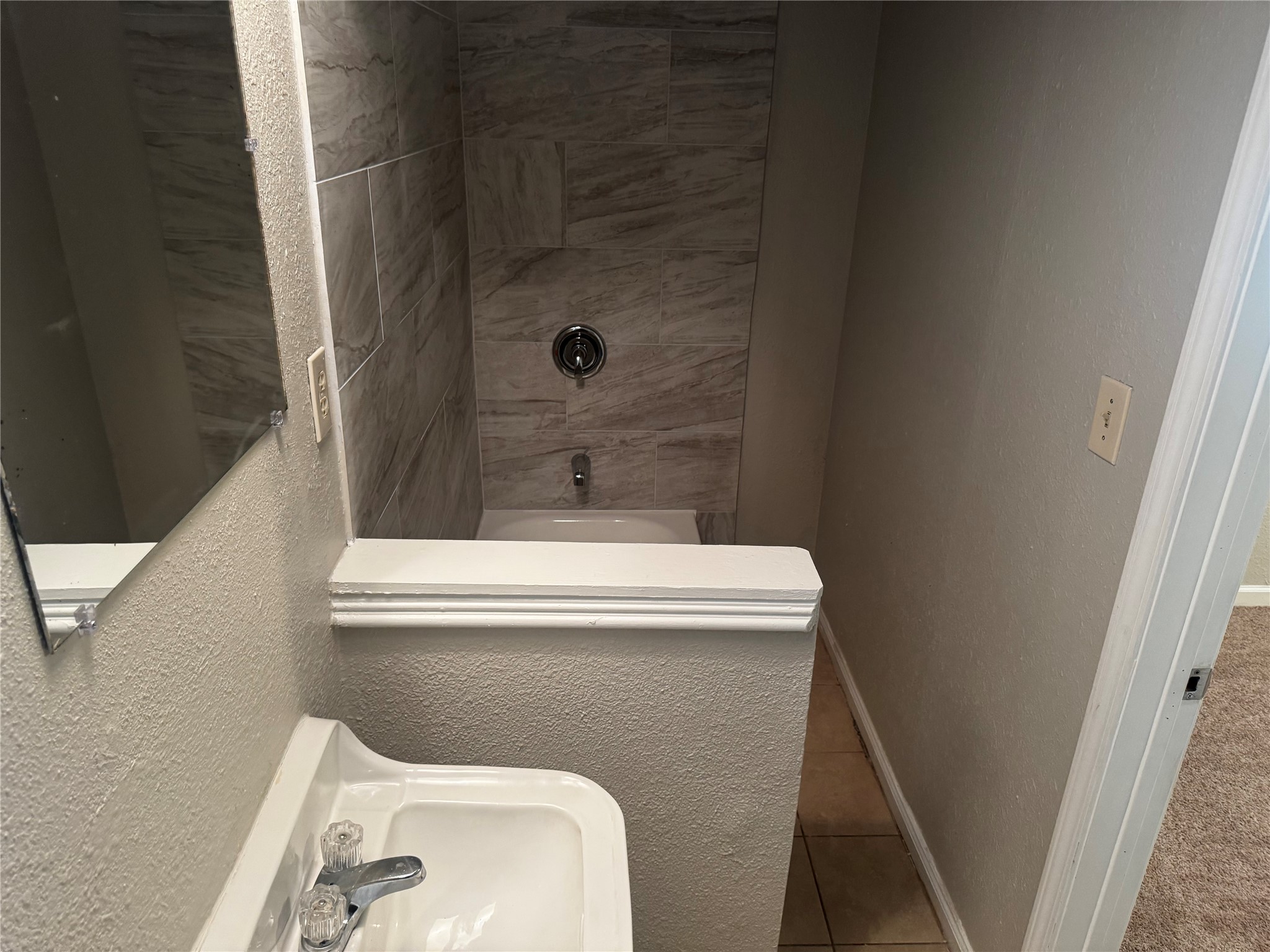 1922 Bunzel Street Houston, TX 77088 - Photo 11 of 16 a bathroom with a toilet and a shower