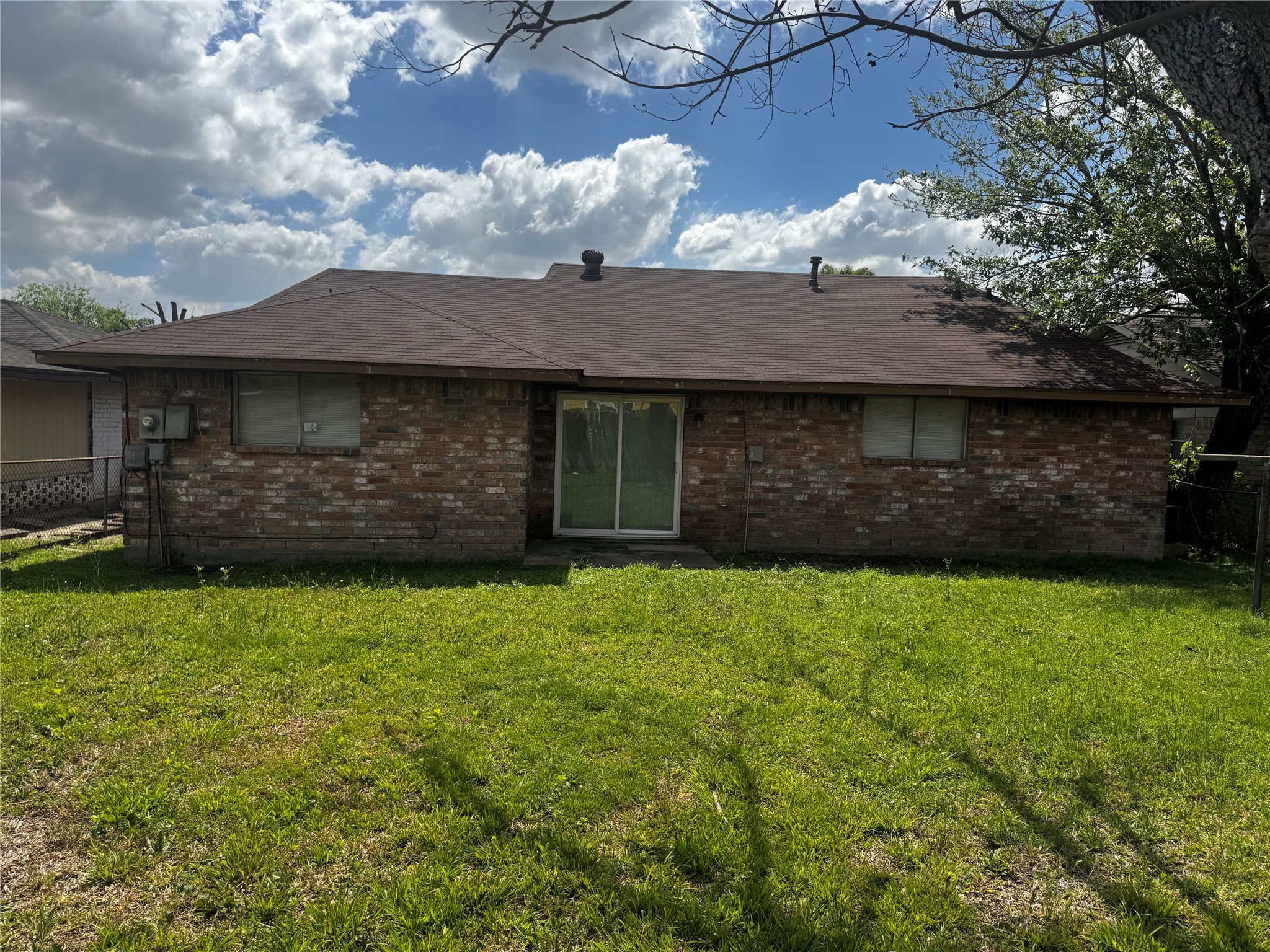 1922 Bunzel Street Houston, TX 77088 - Photo 13 of 16 a front view of a house with a garden
