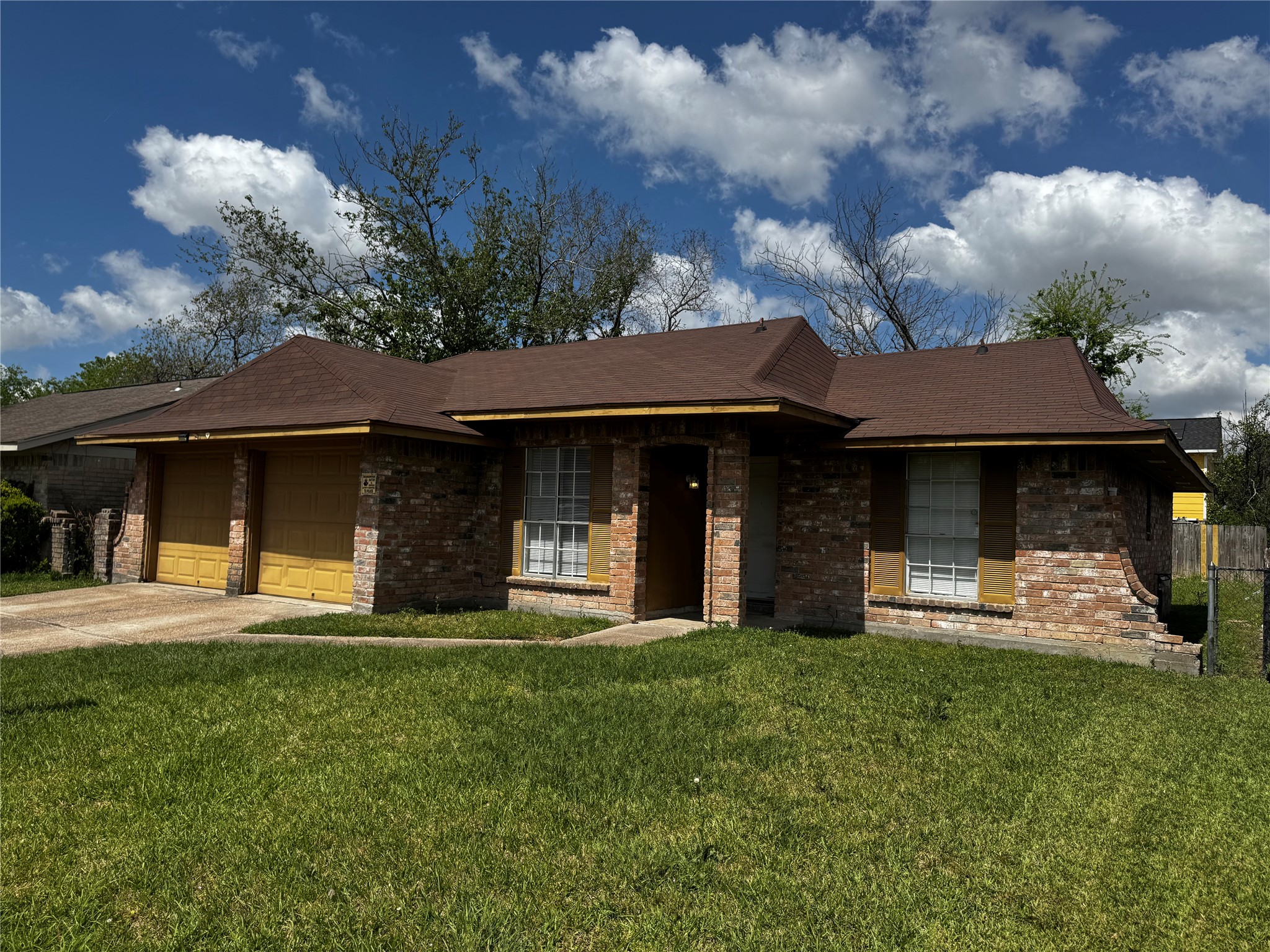 1922 Bunzel Street Houston, TX 77088 - Photo 2 of 16 a front view of a house with a yard