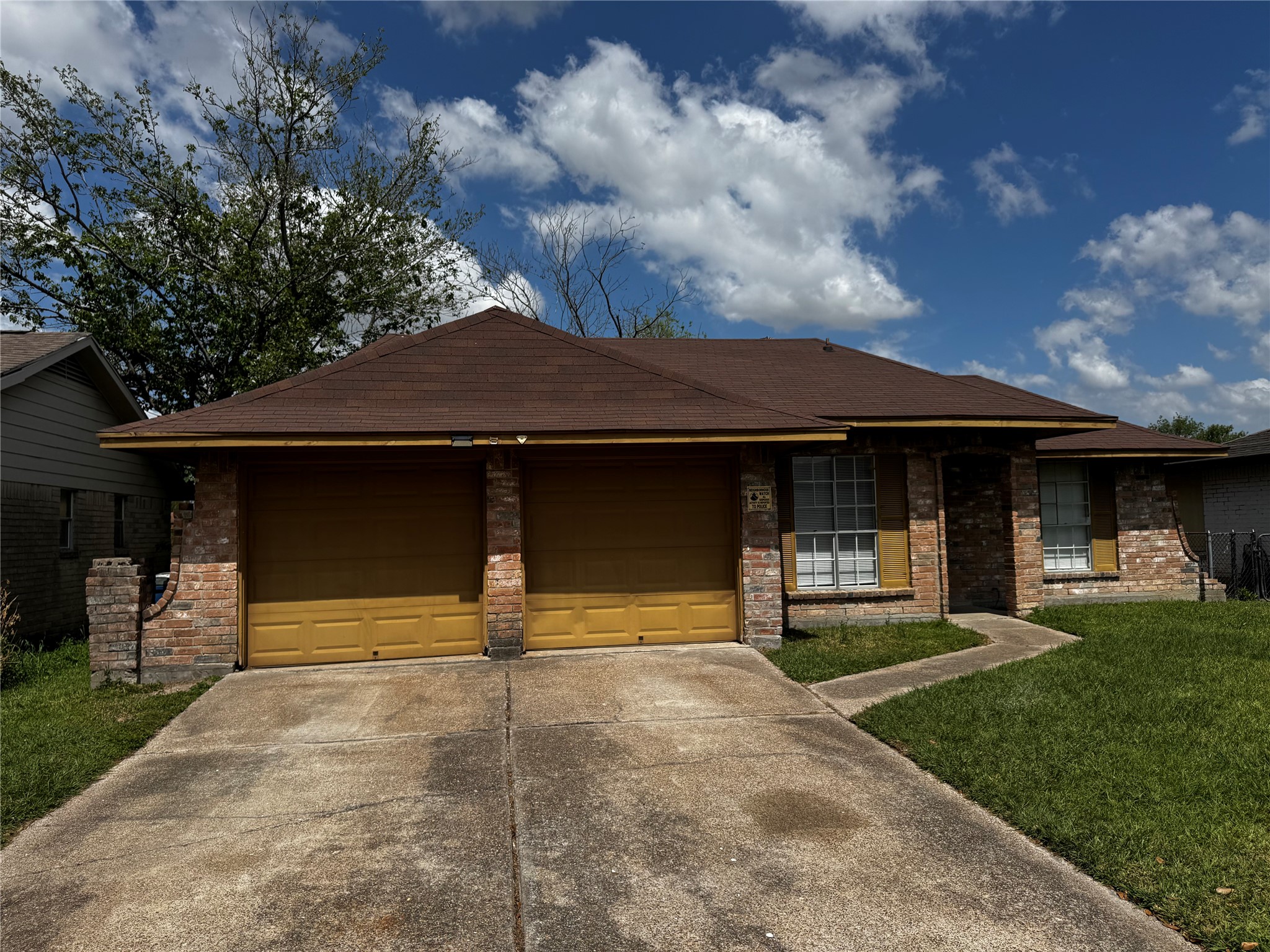 1922 Bunzel Street Houston, TX 77088 - Photo 3 of 16 a front view of a house with a yard
