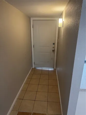 en empty room with wooden floor