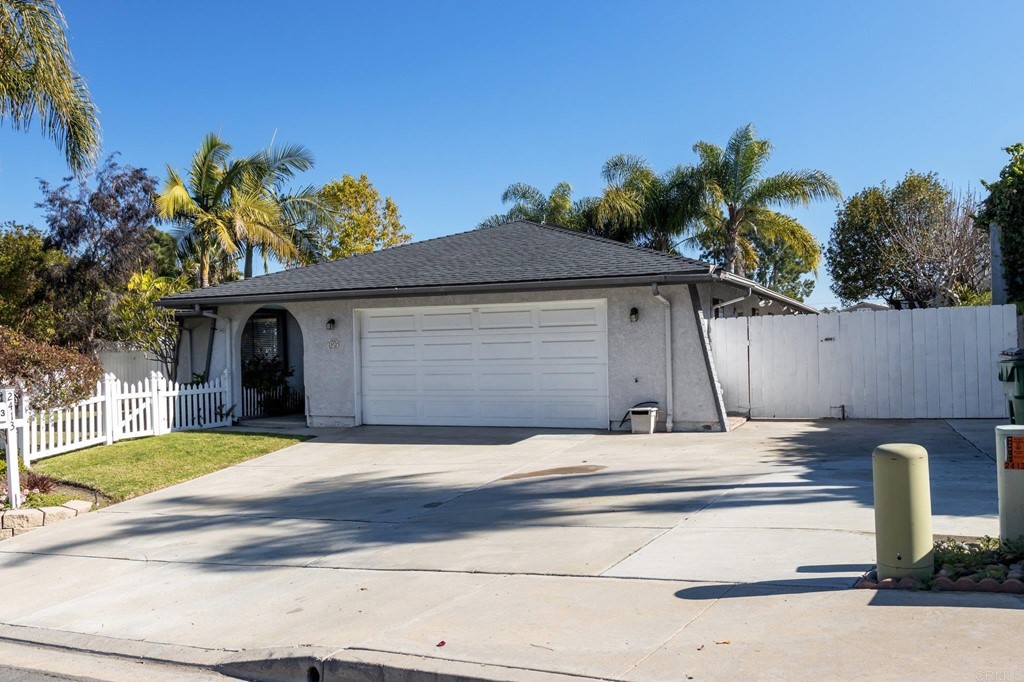 2413 Appian Road Carlsbad, CA 92010 - Photo 1 of 1 a front view of a house with garden