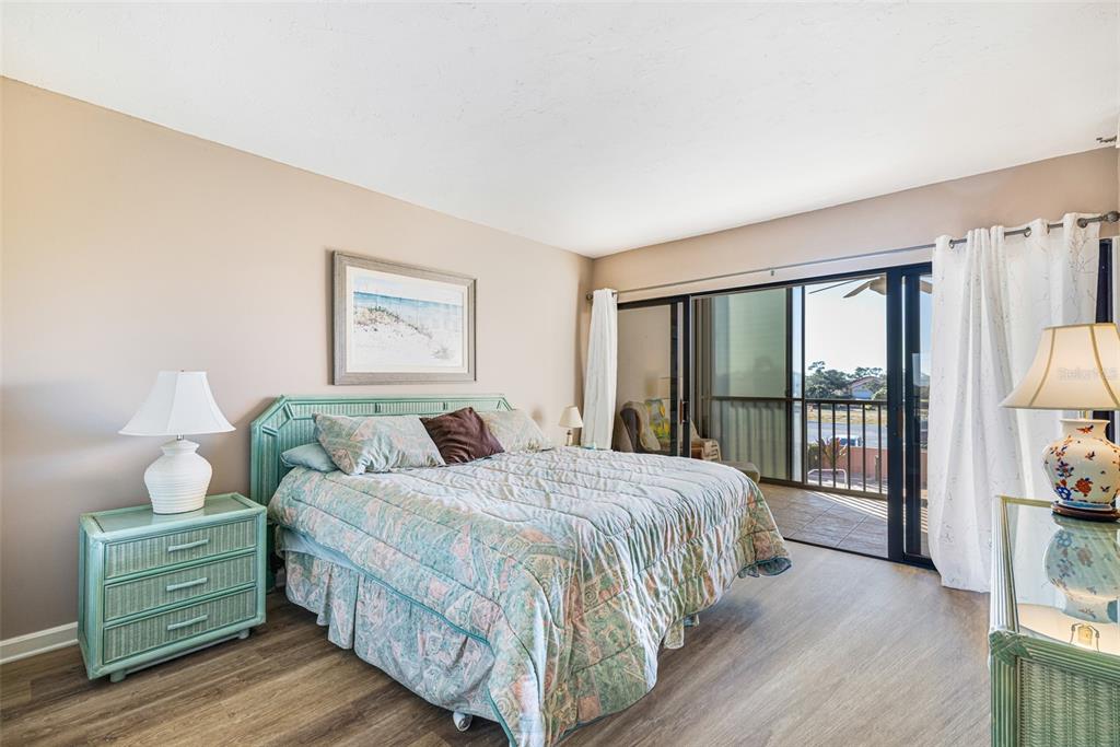 3160 Matecumbe Key Road, Unit 221 Punta Gorda, FL 33955 - Photo 15 of 26 a bedroom with a bed and a large window