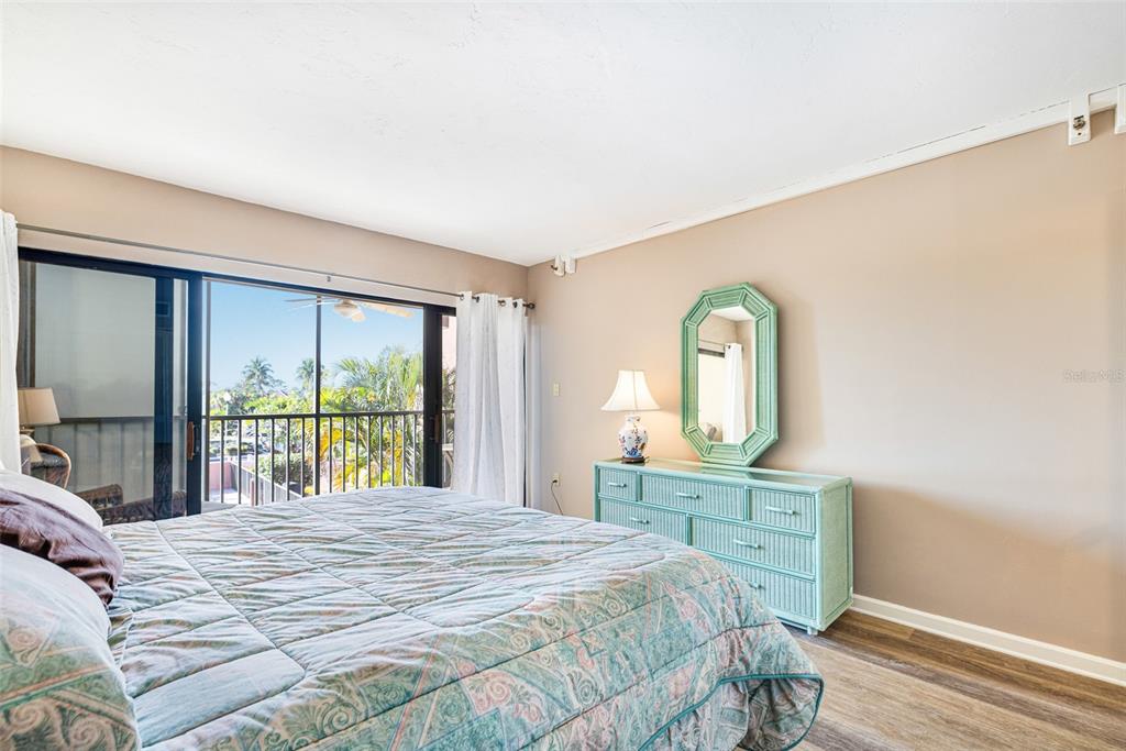 3160 Matecumbe Key Road, Unit 221 Punta Gorda, FL 33955 - Photo 16 of 26 a bedroom with a bed and a large window