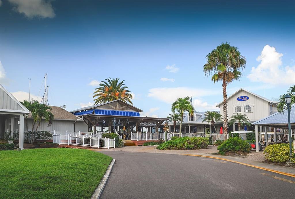 3160 Matecumbe Key Road, Unit 221 Punta Gorda, FL 33955 - Photo 23 of 26 a front view of a house with a yard and a garden