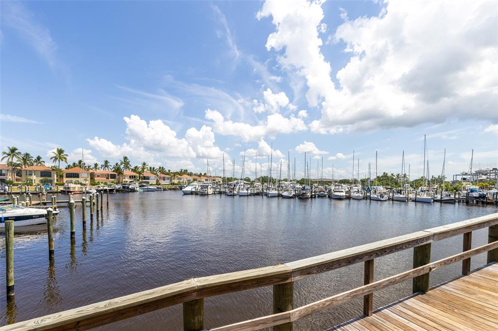 3160 Matecumbe Key Road, Unit 221 Punta Gorda, FL 33955 - Photo 26 of 26 a view of a lake with boats and trees in the background