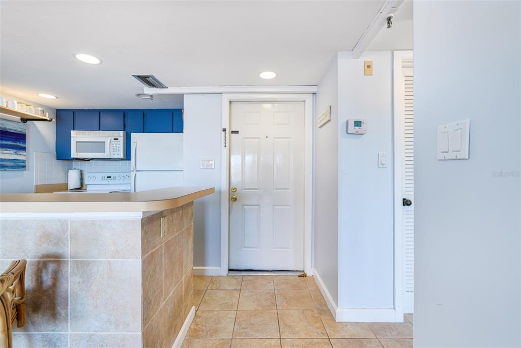 3160 Matecumbe Key Road, Unit 221 Punta Gorda, FL 33955 - Photo 6 of 26 a kitchen with stainless steel appliances granite countertop a refrigerator and a sink