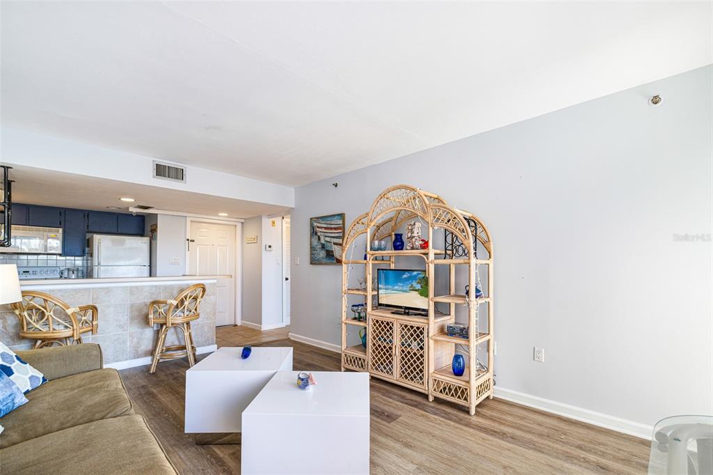 3160 Matecumbe Key Road, Unit 221 Punta Gorda, FL 33955 - Photo 10 of 26 a living room with furniture and wooden floor