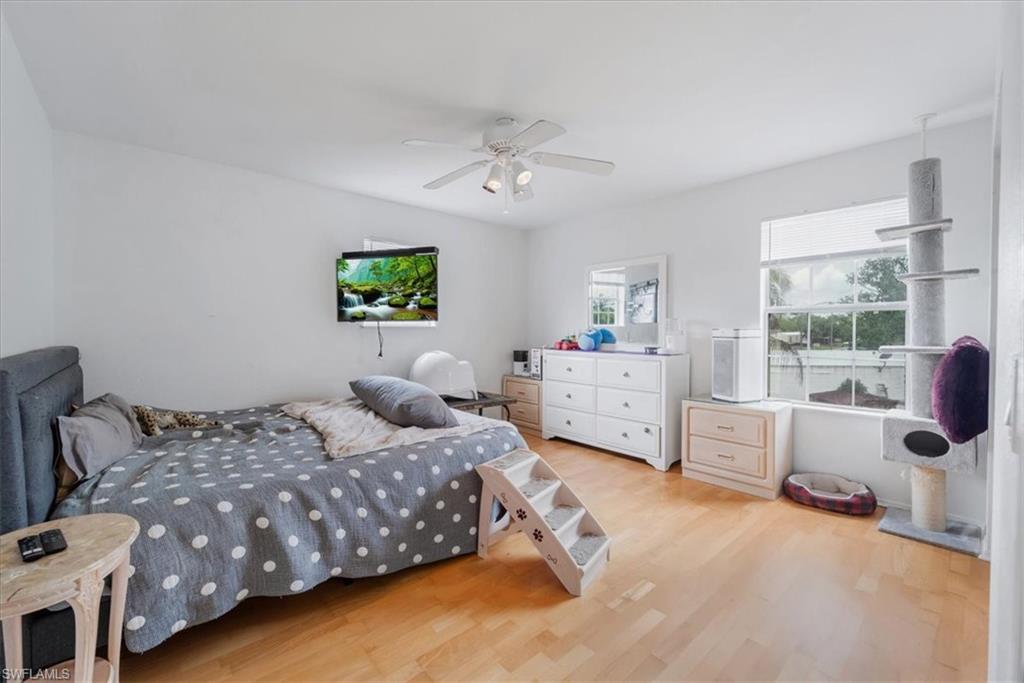 939 Church Avenue Naples, FL 34114 - Photo 13 of 31 a bedroom with a bed and a window