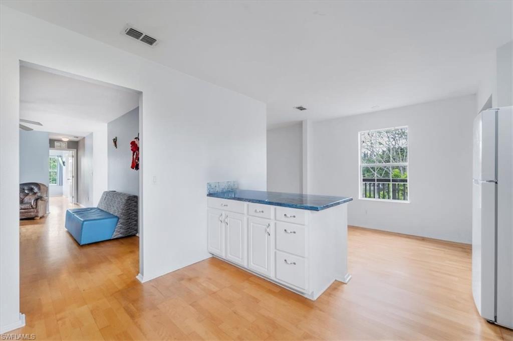 939 Church Avenue Naples, FL 34114 - Photo 18 of 31 a view of an empty room with cabinet and wooden floor