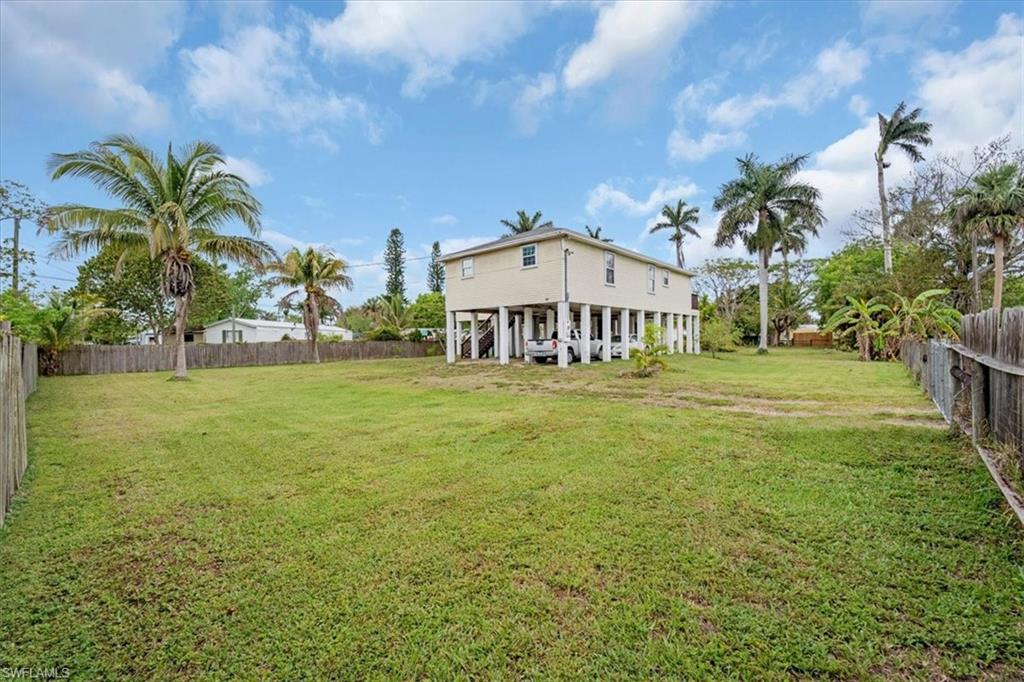 939 Church Avenue Naples, FL 34114 - Photo 24 of 31 a front view of a house with garden