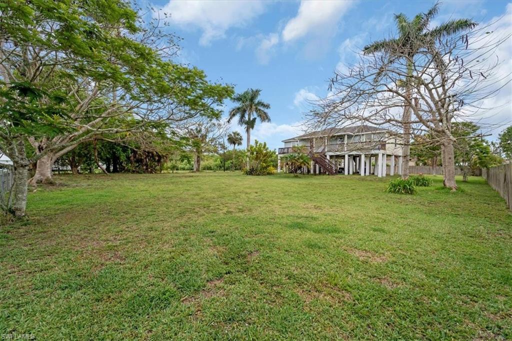 939 Church Avenue Naples, FL 34114 - Photo 26 of 31 a view of a house with a big yard
