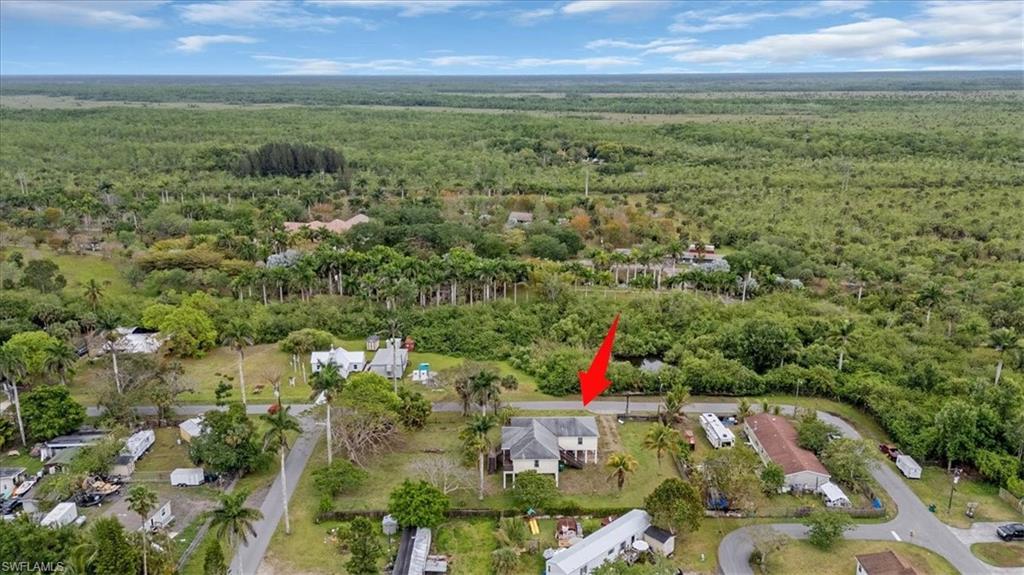 939 Church Avenue Naples, FL 34114 - Photo 31 of 31 an aerial view of residential houses with outdoor space and trees