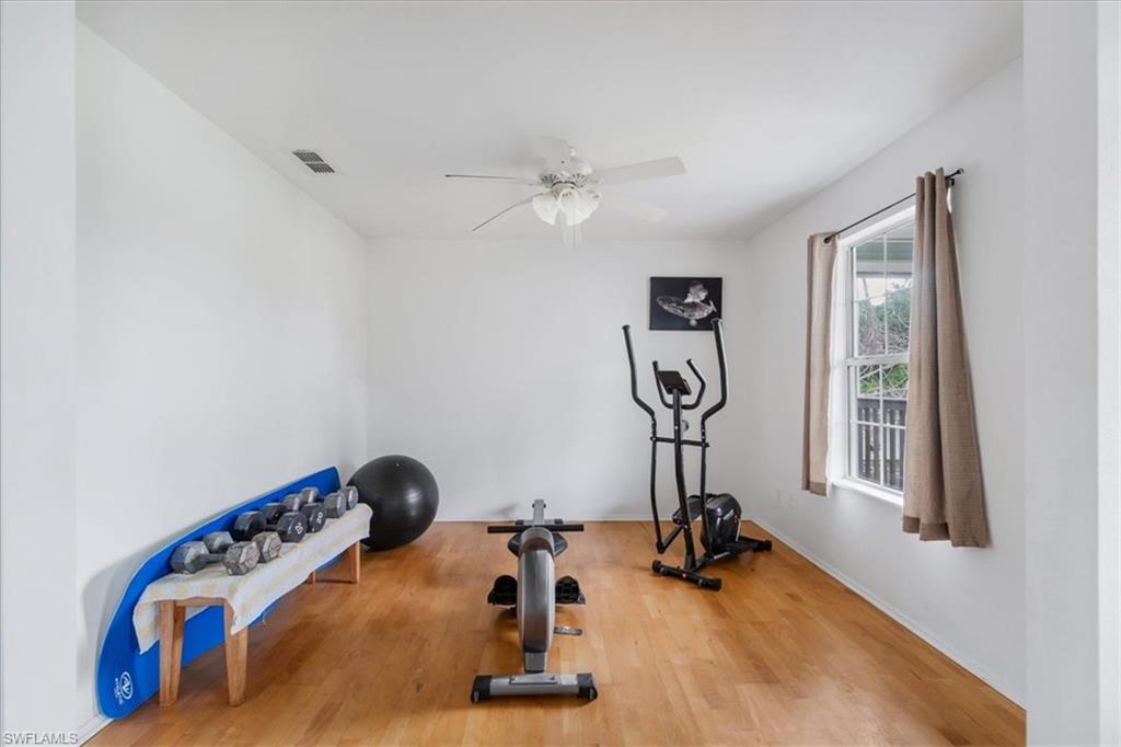 939 Church Avenue Naples, FL 34114 - Photo 5 of 31 a view of a room with gym equipment