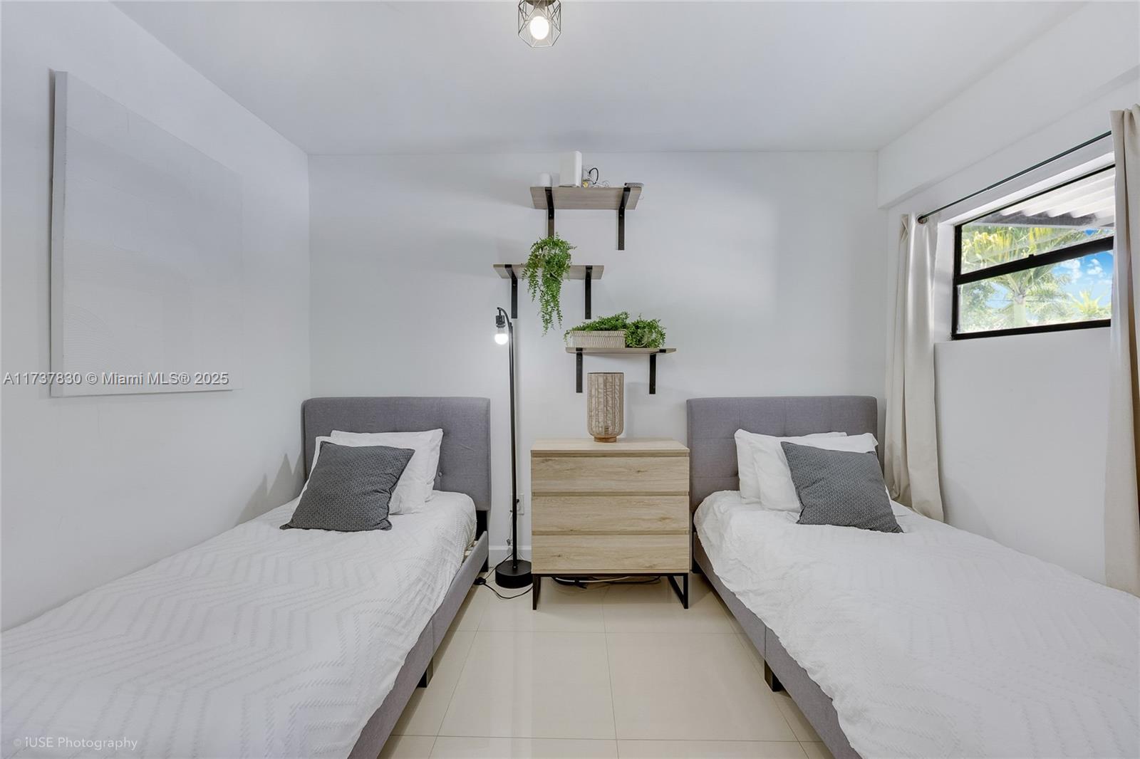 1401 Southwest 3rd Avenue Dania Beach, FL 33004 - Photo 11 of 15 a bedroom with a bed and window