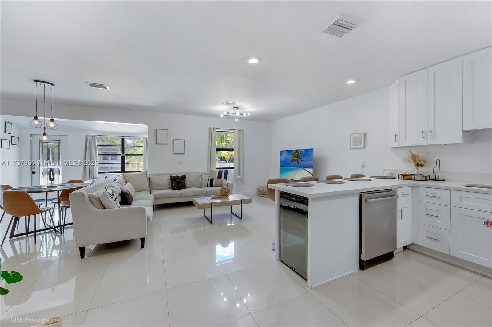 1401 Southwest 3rd Avenue Dania Beach, FL 33004 - Photo 14 of 15 a living room with furniture and a open kitchen