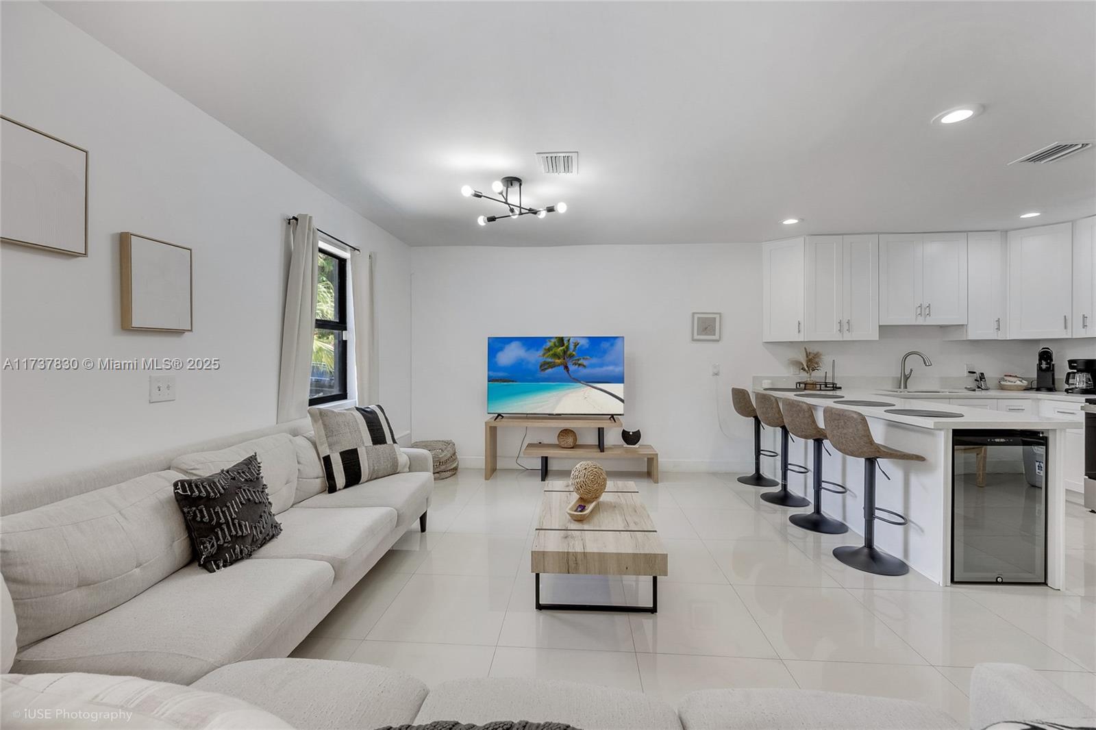 1401 Southwest 3rd Avenue Dania Beach, FL 33004 - Photo 6 of 15 a living room with furniture kitchen view and a window